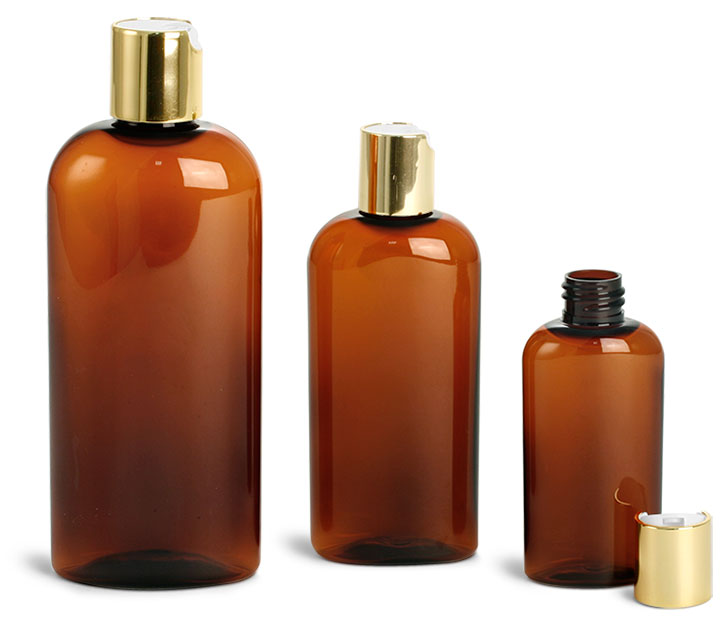 Plastic Bottles, Amber PET Cosmo Oval w/ Gold Disc Top Caps