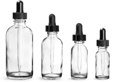 clear glass bottles with lids